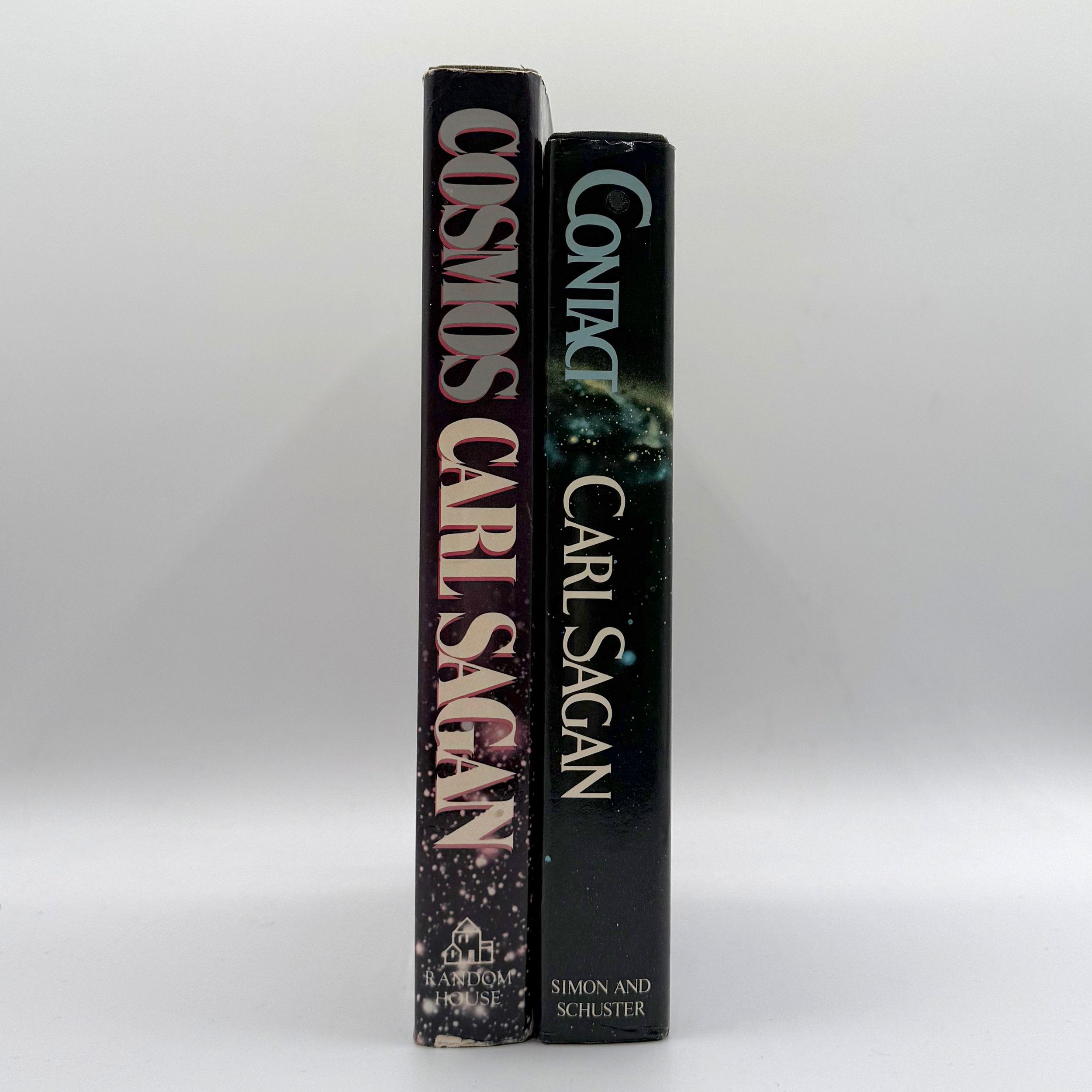 Two books by Carl Sagan, 'Cosmos' and 'Contact', on a white background.