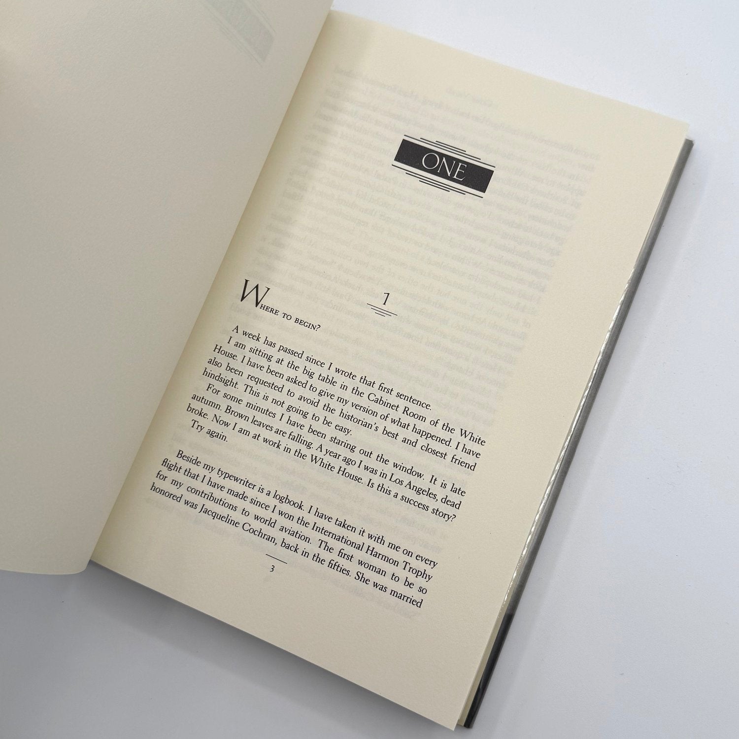 Open book with text on a white background