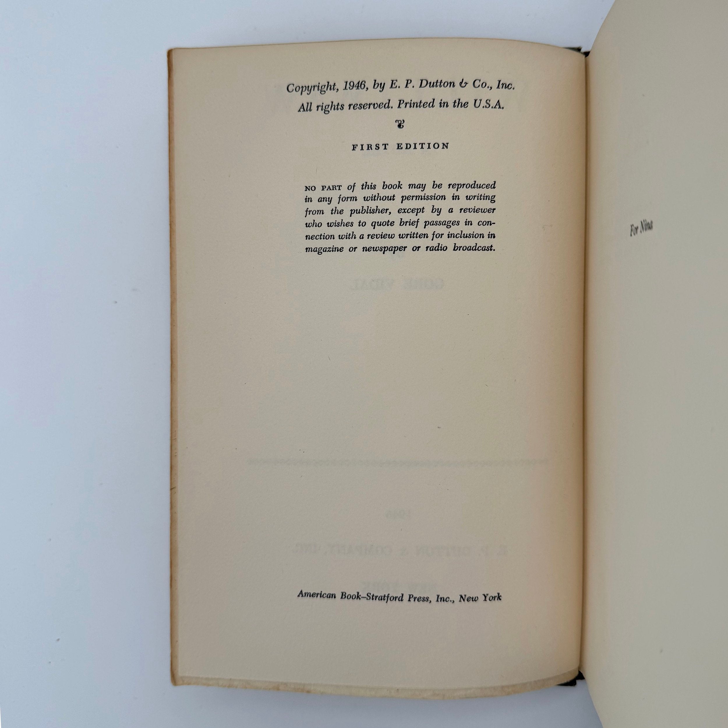 Open book showing copyright page with text on a white background