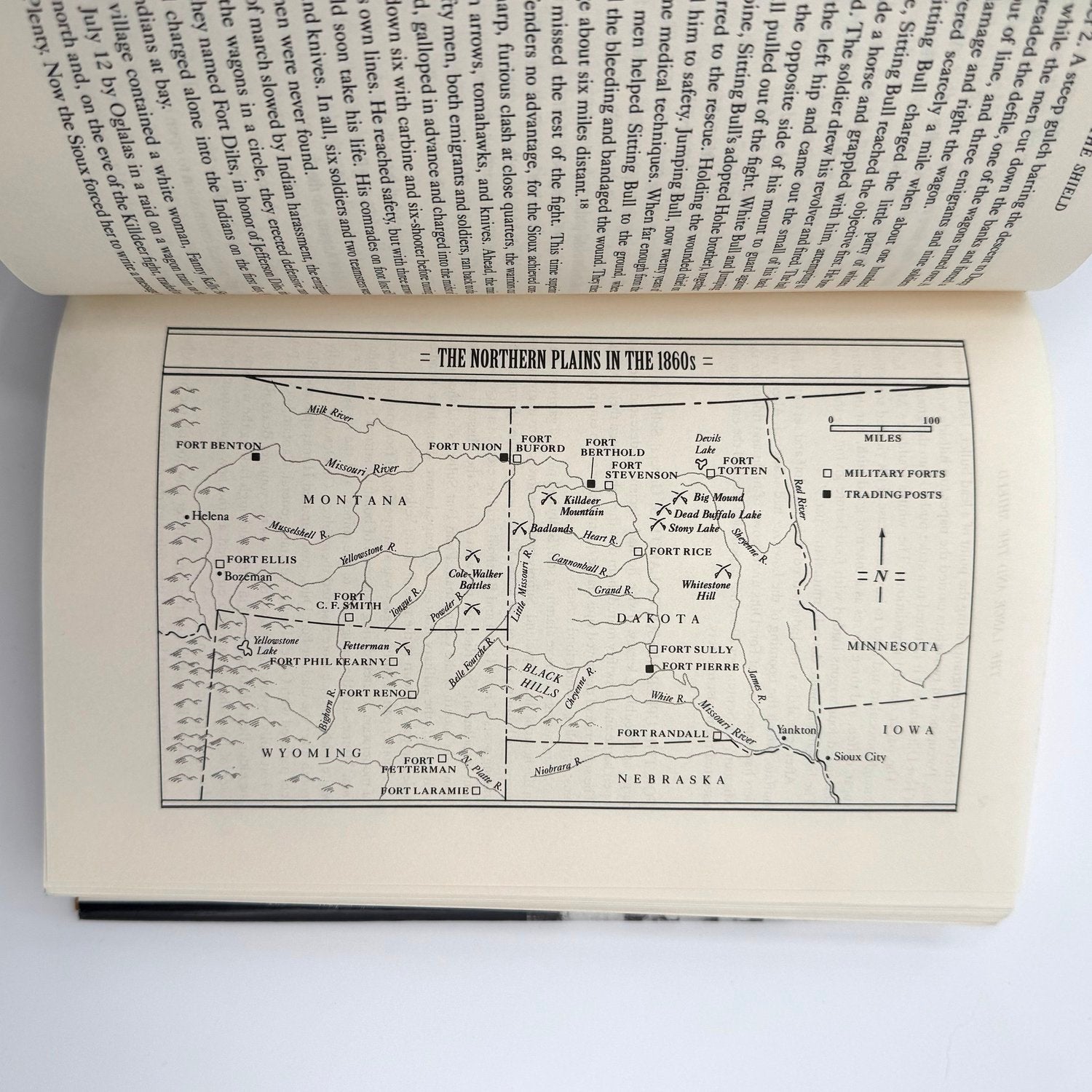 Open book with a map of the Northern Plains in the 1860s on a white background