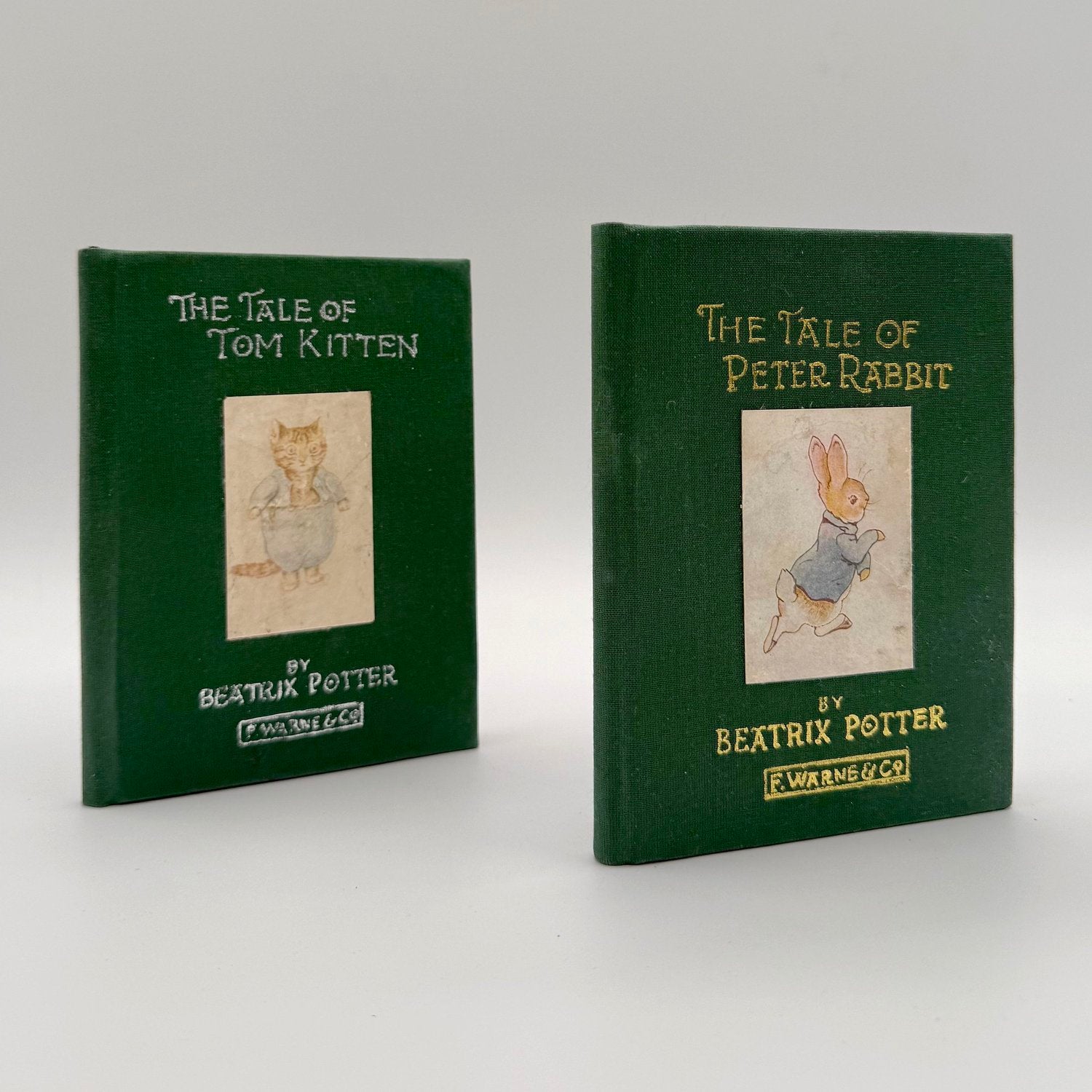 Beatrix Potter first edition set - Tale of Peter Rabbit and Tom Kitten restored green cloth binding
