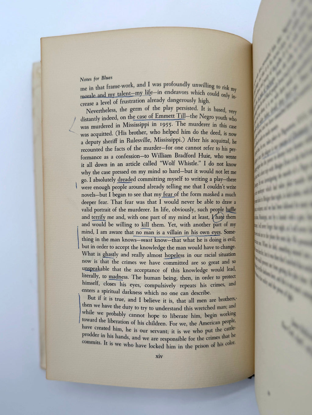 Open book with text on a white background