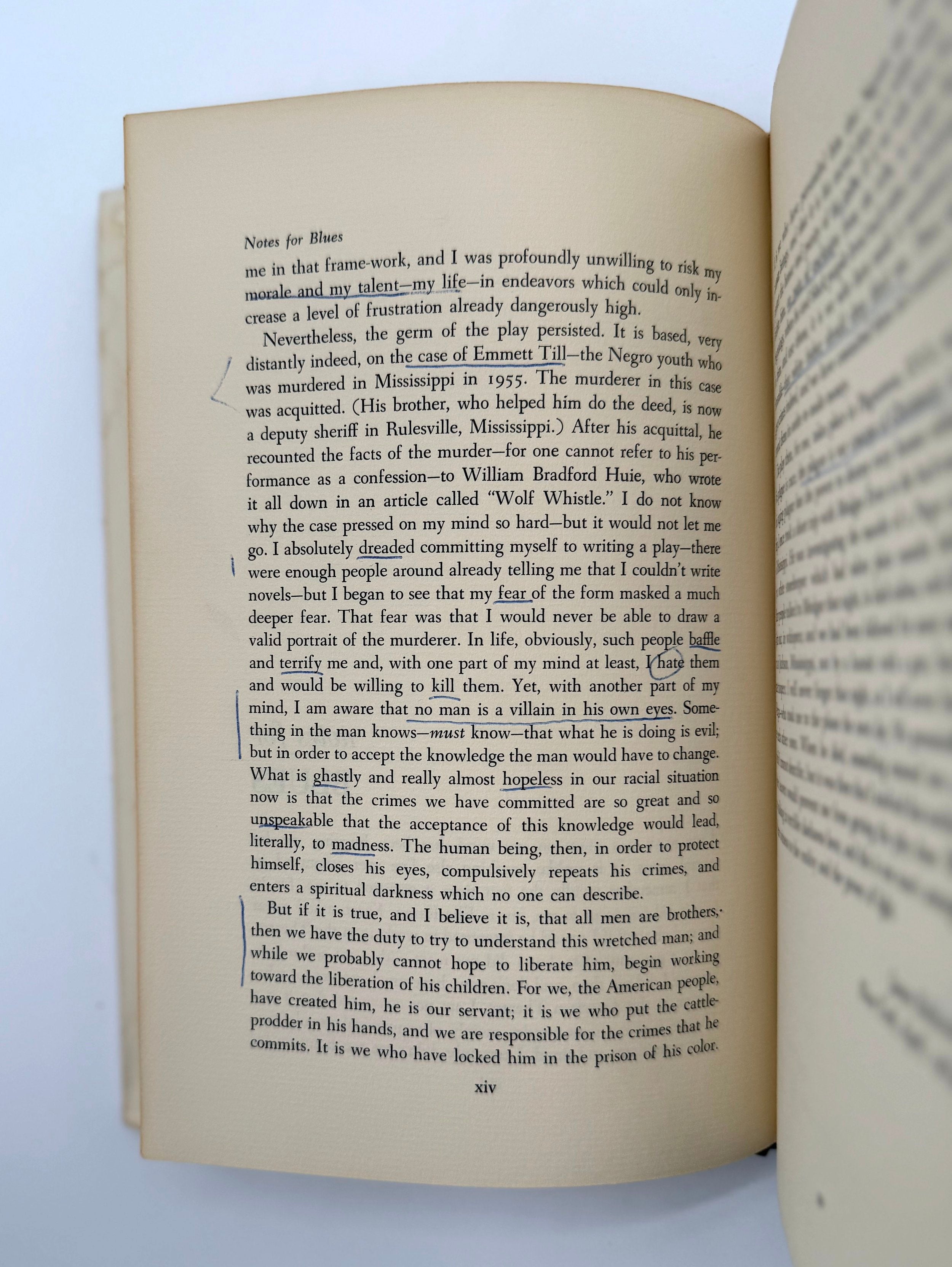 Open book with text on a white background