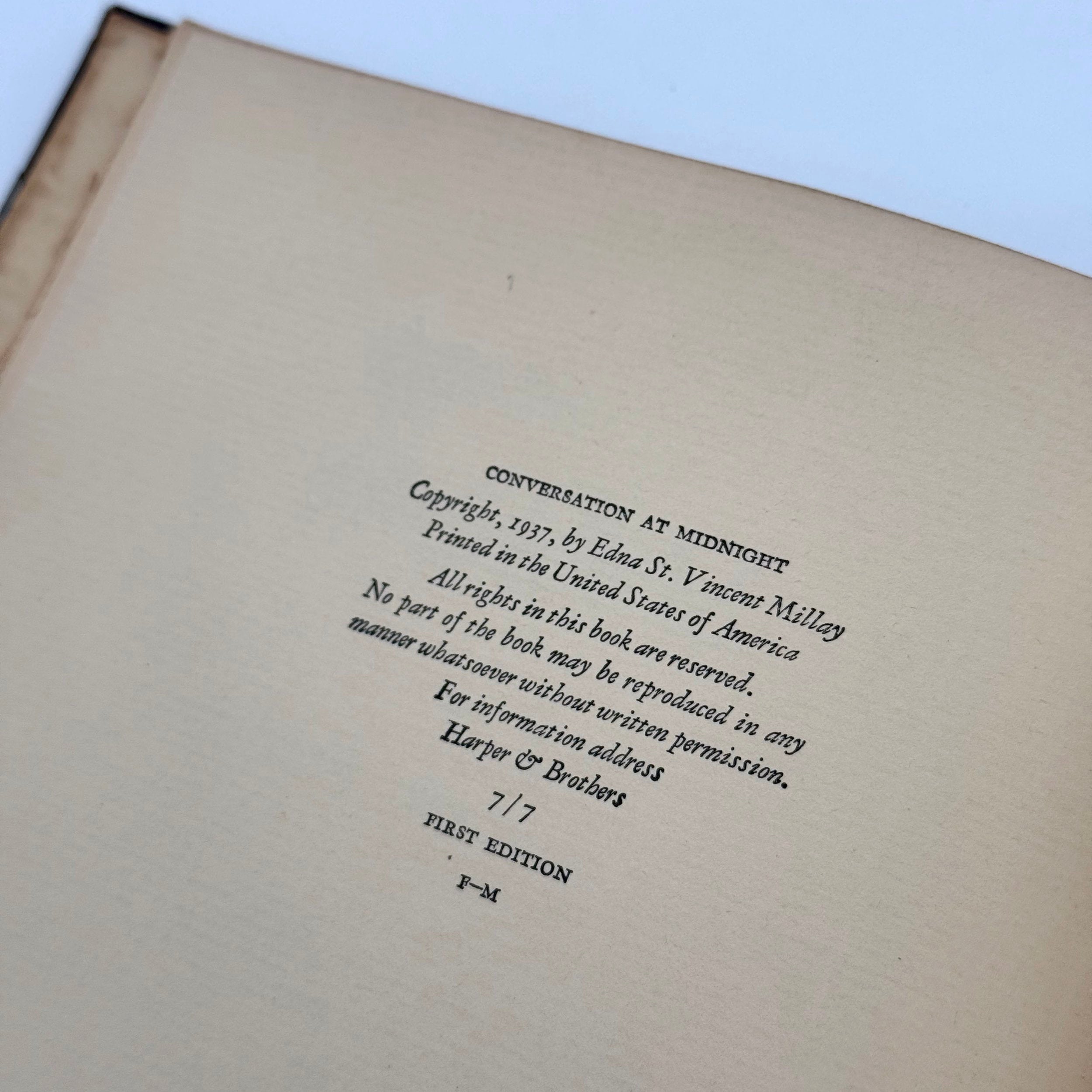 Book page with copyright information on a plain background