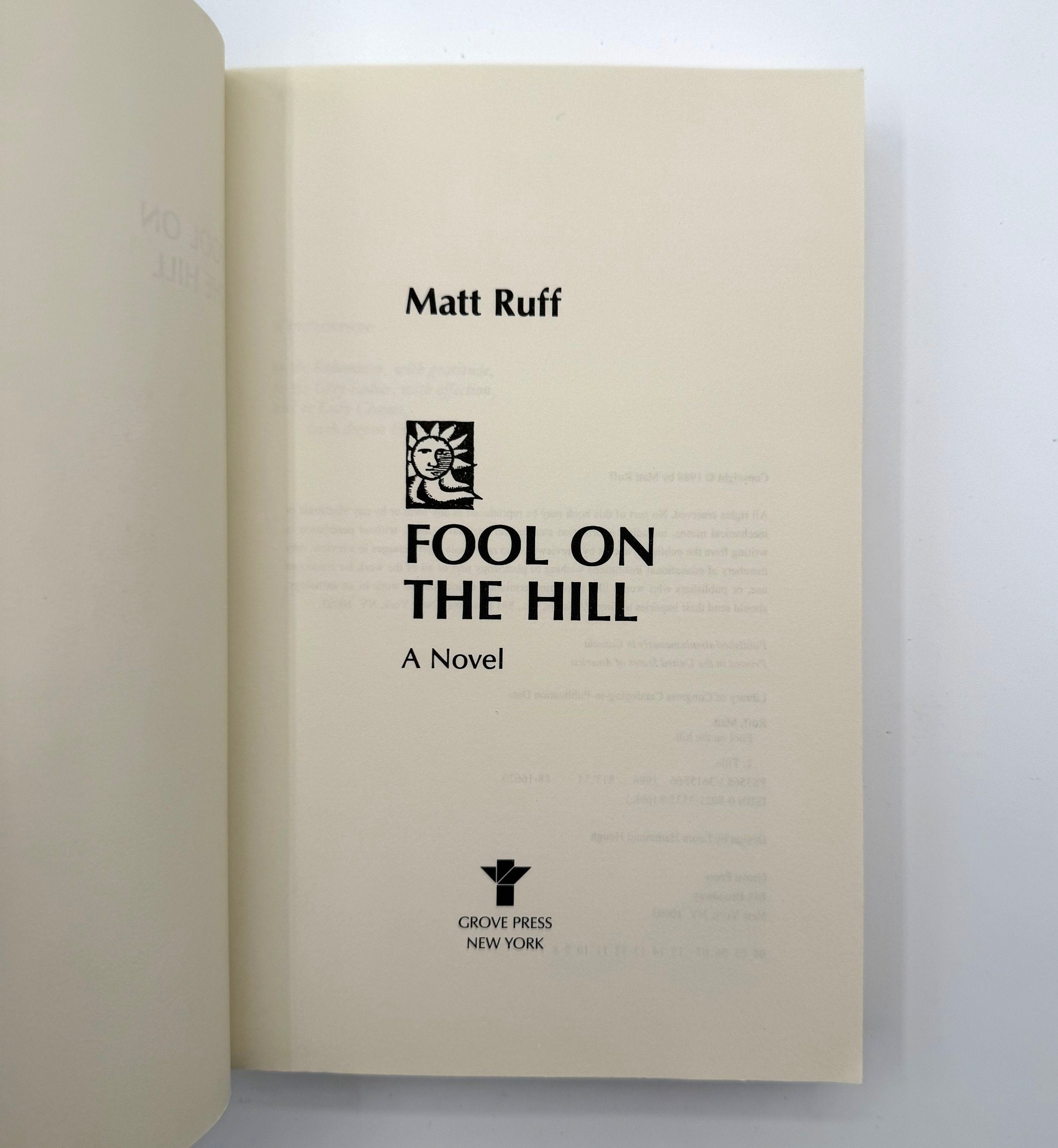 Book titled 'Fool on the Hill' by Matt Ruff with Grove Press New York logo.