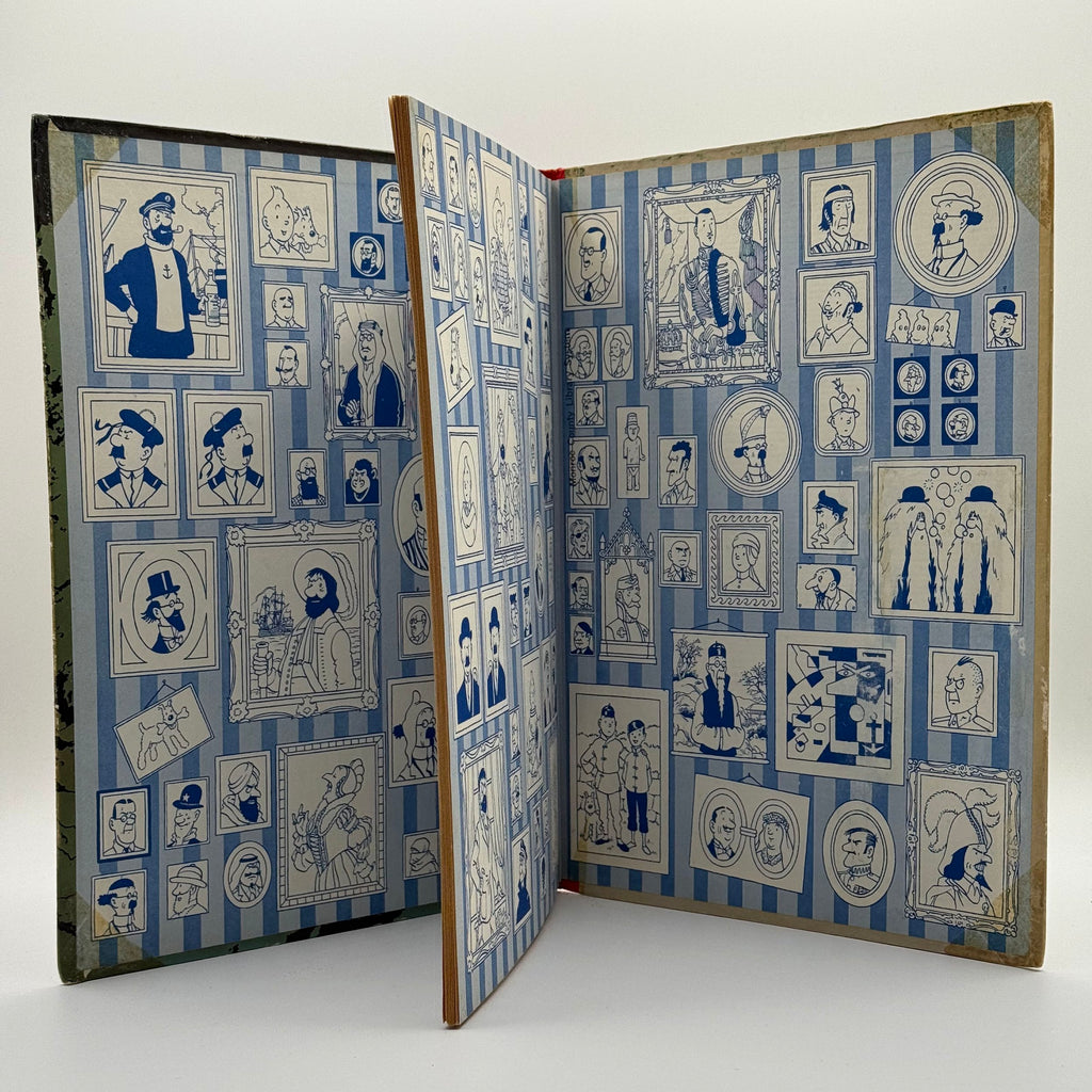 Open book with decorative blue and white pattern on a white background