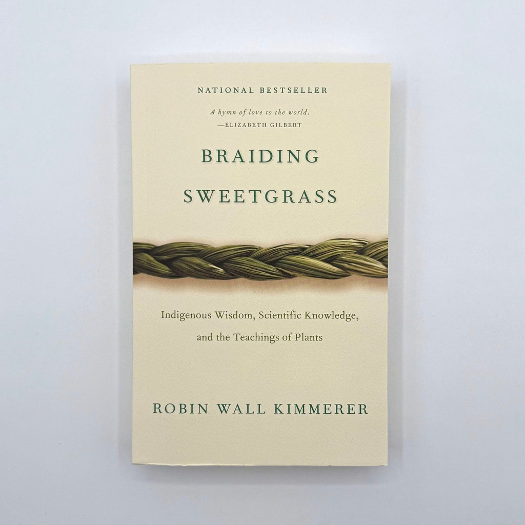 Book cover of 'Braiding Sweetgrass' by Robin Wall Kimmerer on a light gray background
