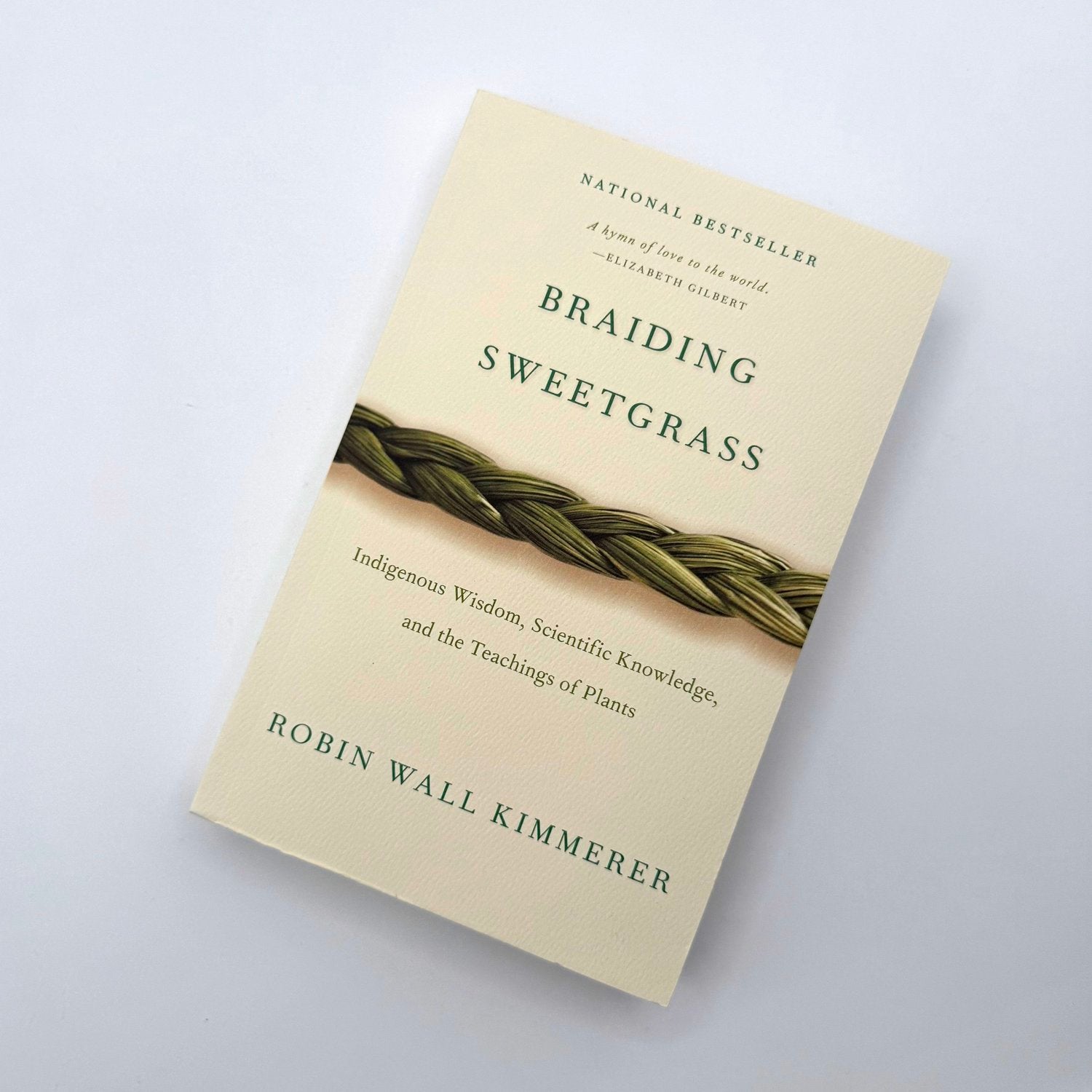 Braiding Sweetgrass by Robin Wall Kimmerer paperback book cover - Indigenous wisdom ecology nature writing