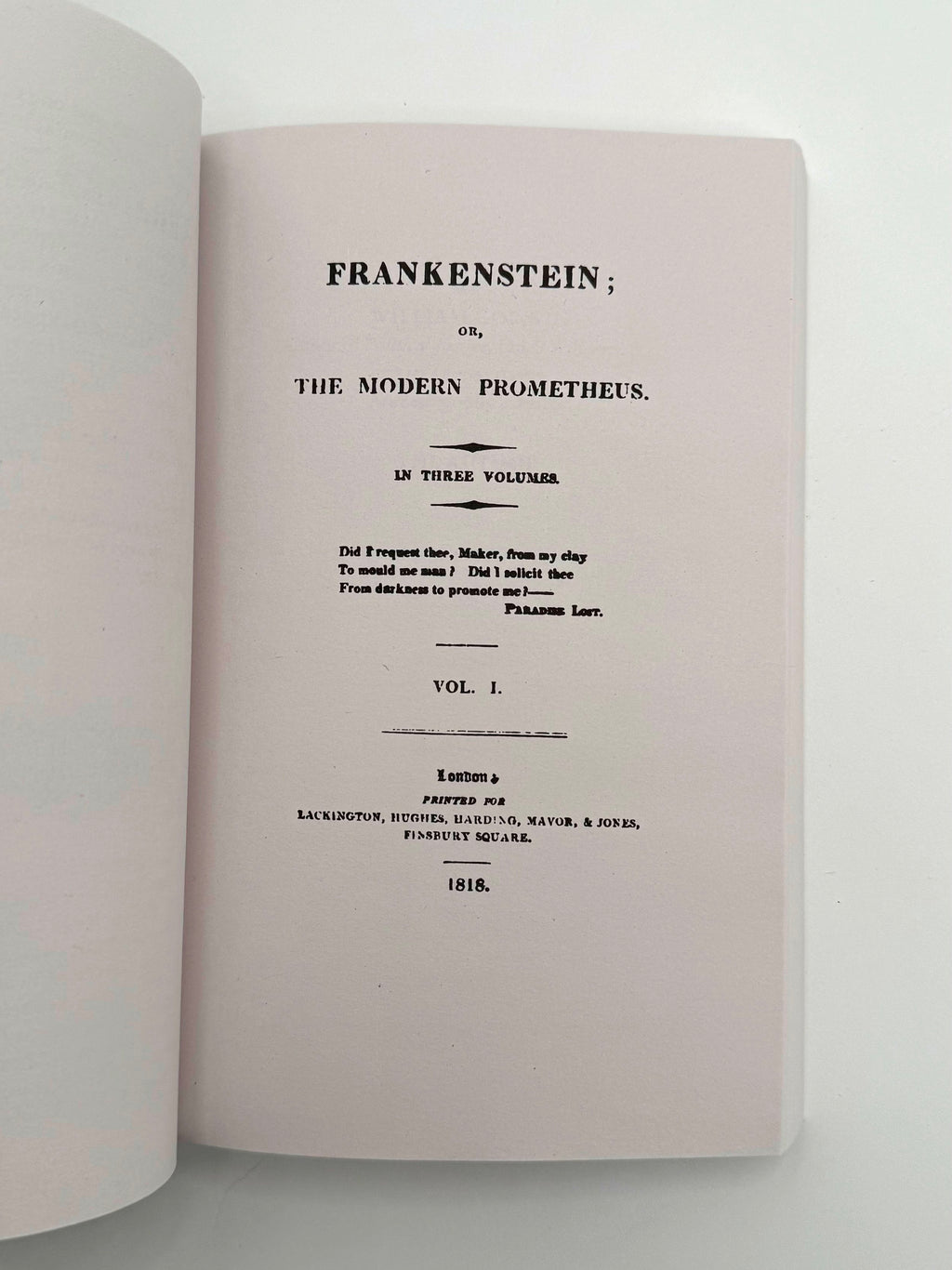 Open book showing the title page of 'Frankenstein' by Mary Shelley.