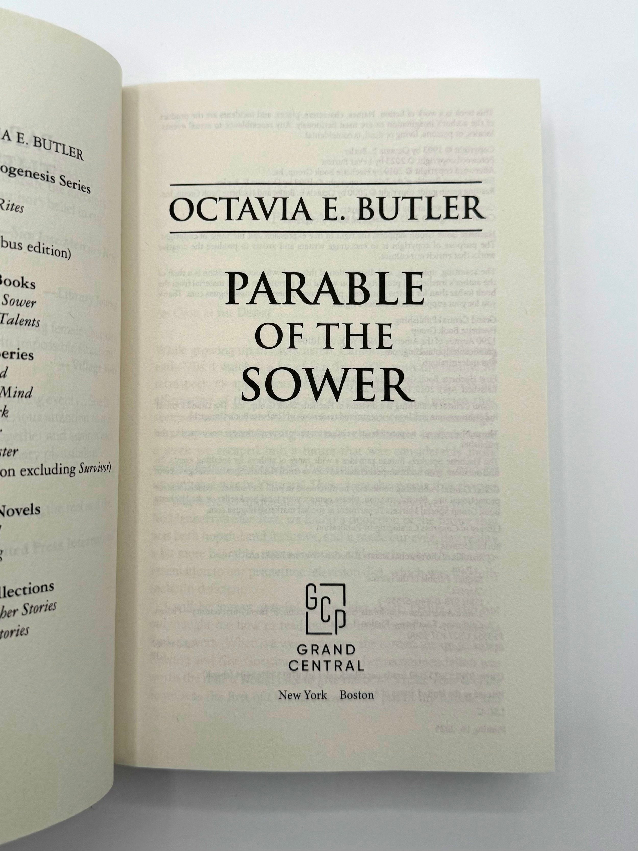 Open book displaying the title 'Parable of the Sower' by Octavia E. Butler.