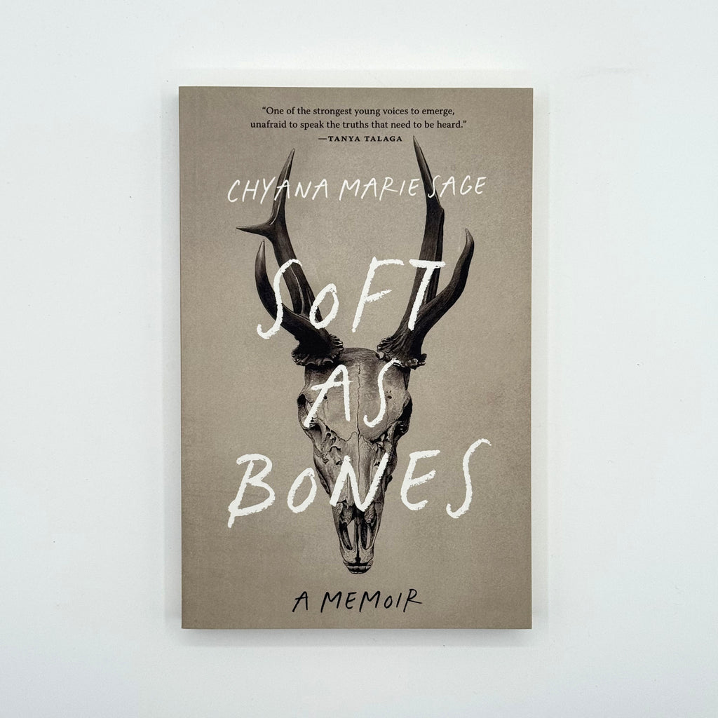 Book cover of 'Soft as Bones' with deer skull illustration and text on a beige background