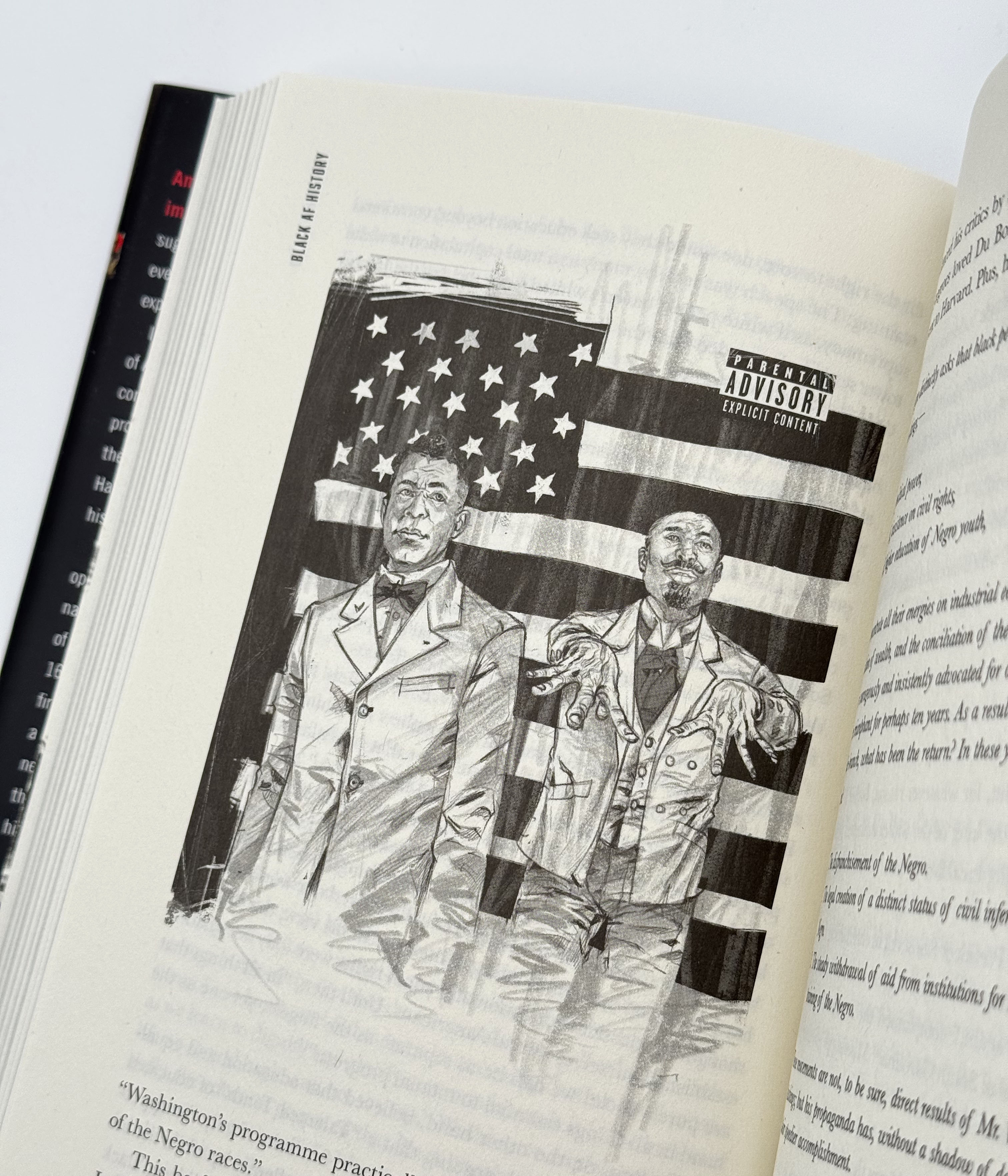 Open book with illustration of two men and an American flag on a white background