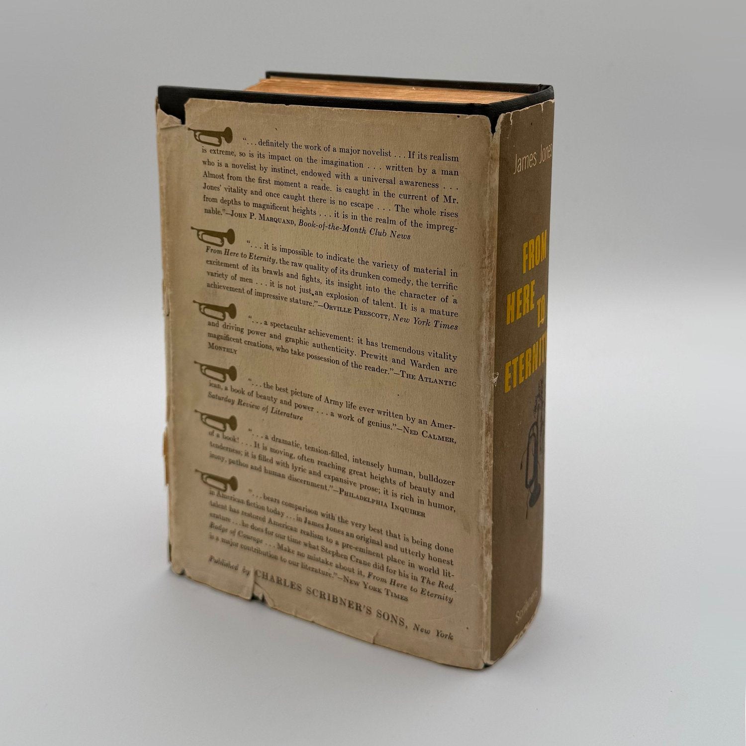 Vintage book with brown cover and black spine on a gray background