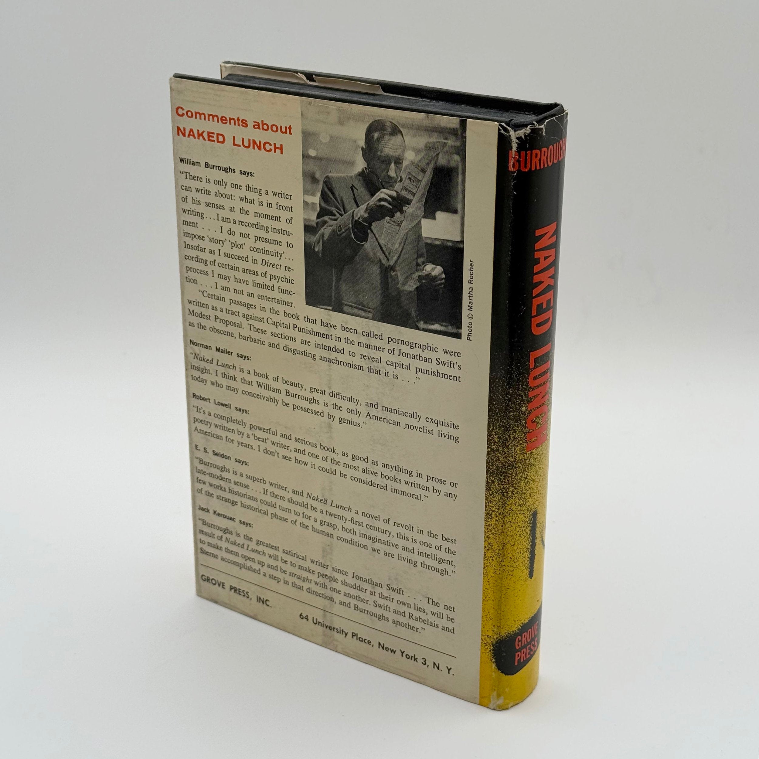 Book titled 'Naked Lunch' with a black and white photo on the back