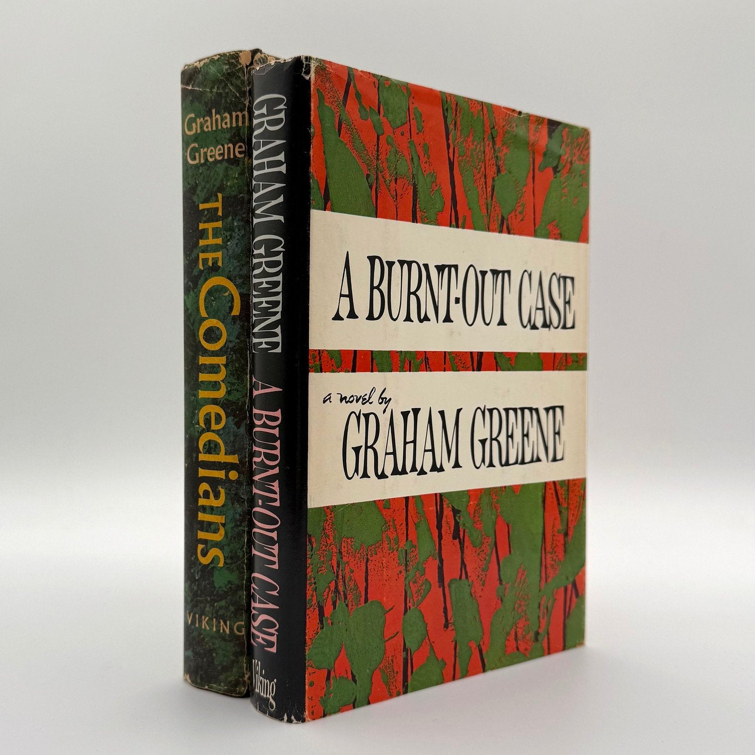 Two books by Graham Greene on a white background