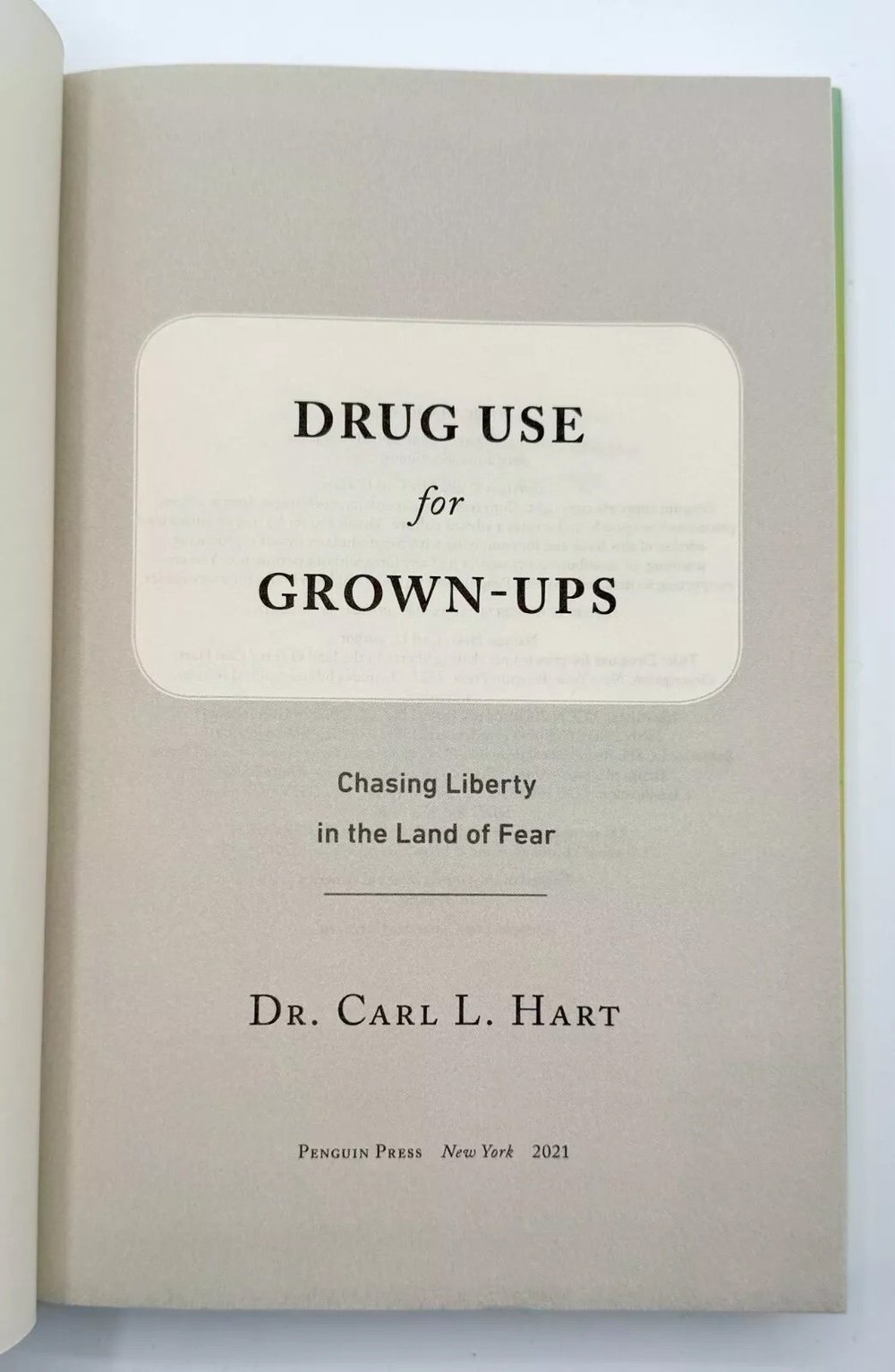 Book titled 'Drug Use for Grown-Ups' by Dr. Carl L. Hart on a white background