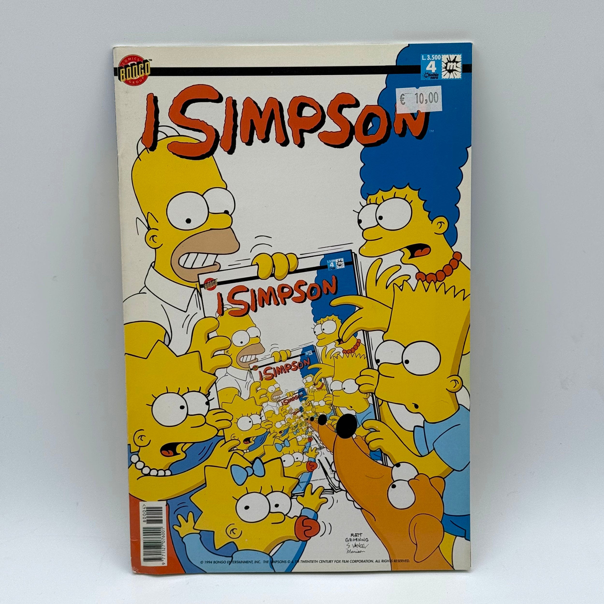 Comic book cover featuring characters from 'The Simpsons' with a white background