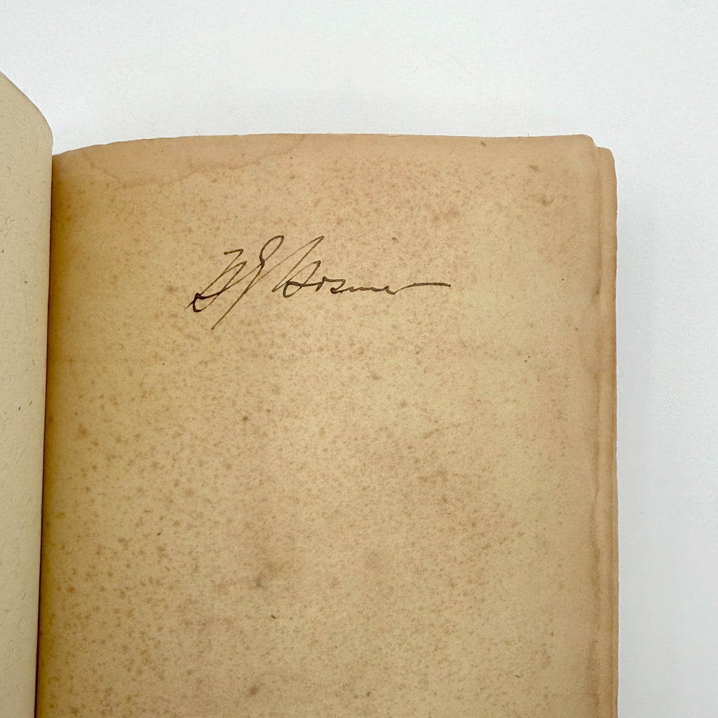 Vintage book with a signature on a white background