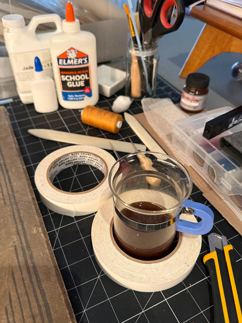 Workbench with Elmer's school glue, scissors, and other crafting supplies.
