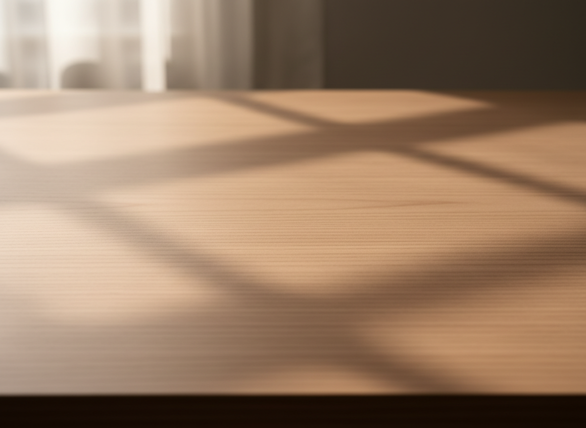 Wooden surface with natural light casting shadows