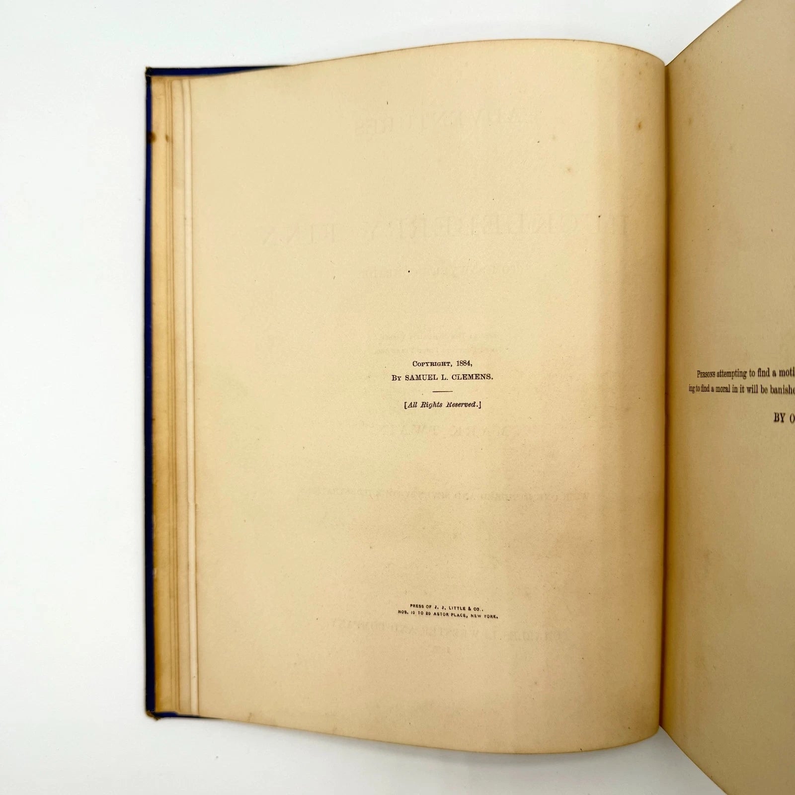 Open book with visible text on a white background