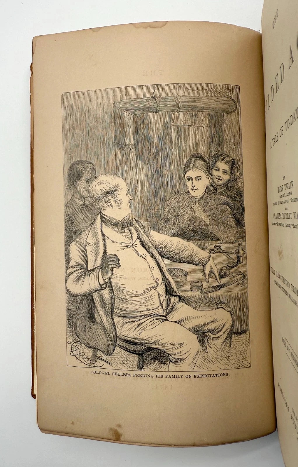 Open book with an illustration of a man and two women in a rustic setting.