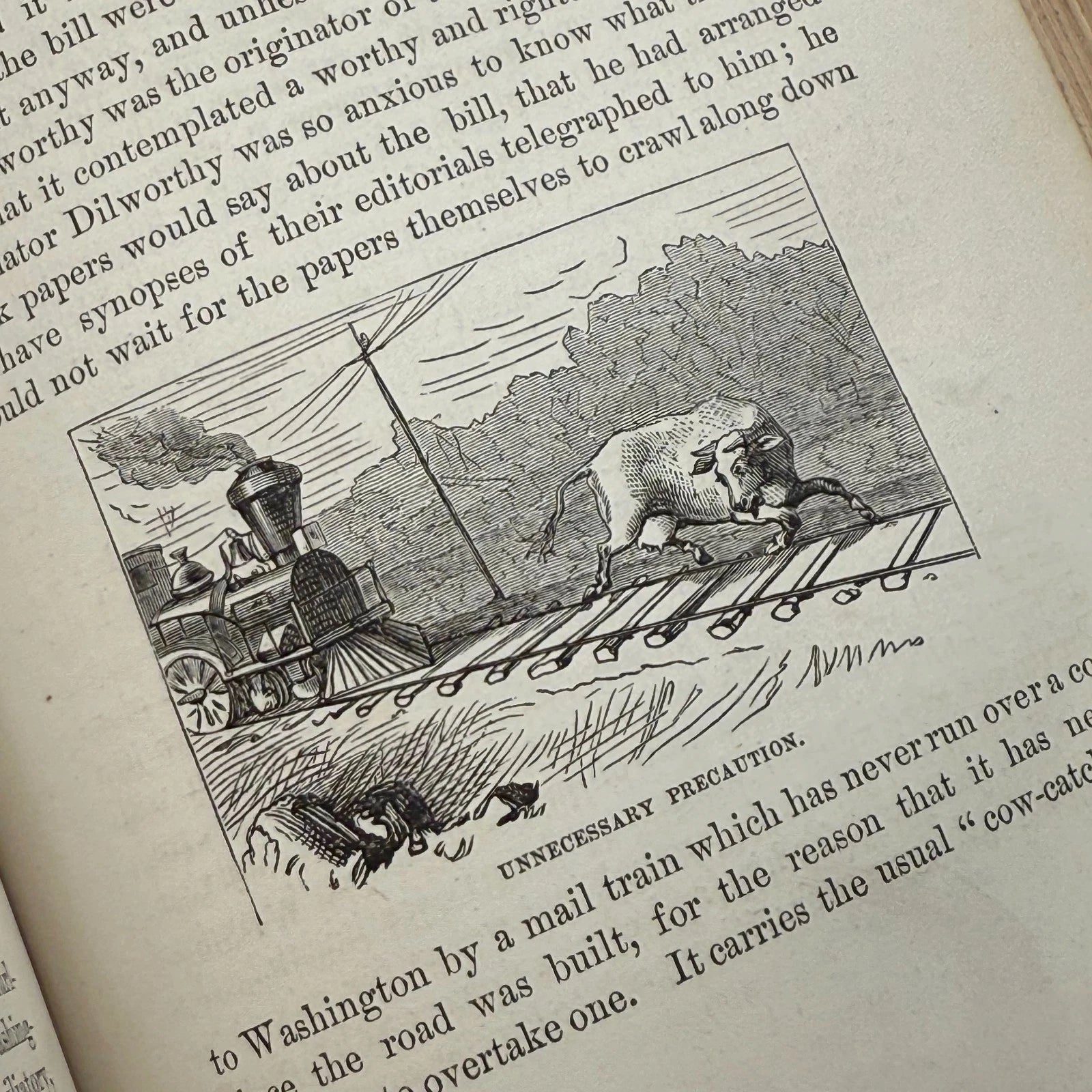 Vintage illustration of a bull on train tracks with a steam locomotive, surrounded by text.